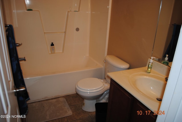 full bathroom with  shower combination, vanity, toilet, and tile patterned flooring