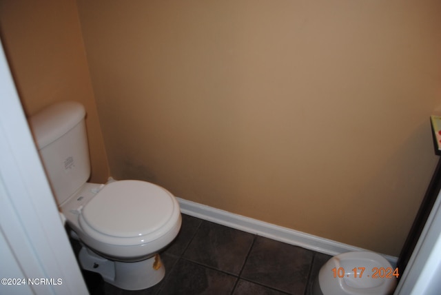 bathroom featuring tile patterned floors and toilet