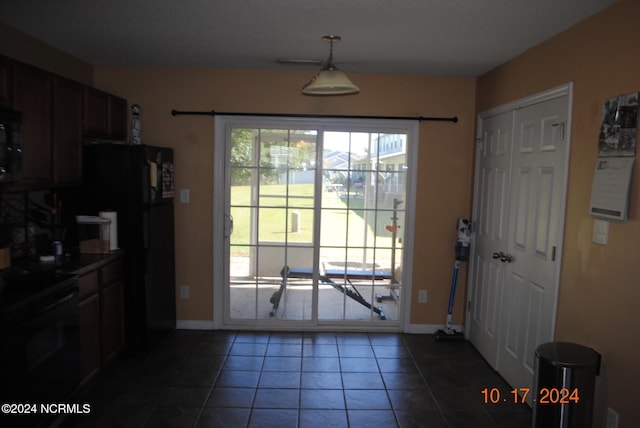 entryway with tile patterned floors