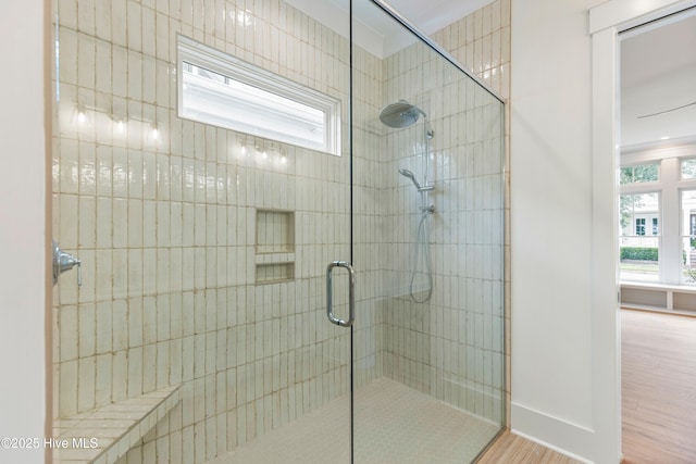 5312 Hanahan Dr, Wilmington, NC 28403 - bathroom with tiled shower and wood finished floors