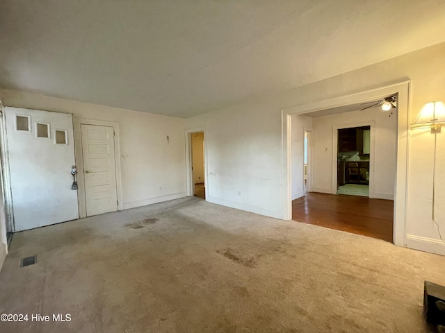 unfurnished room with ceiling fan and wood-type flooring