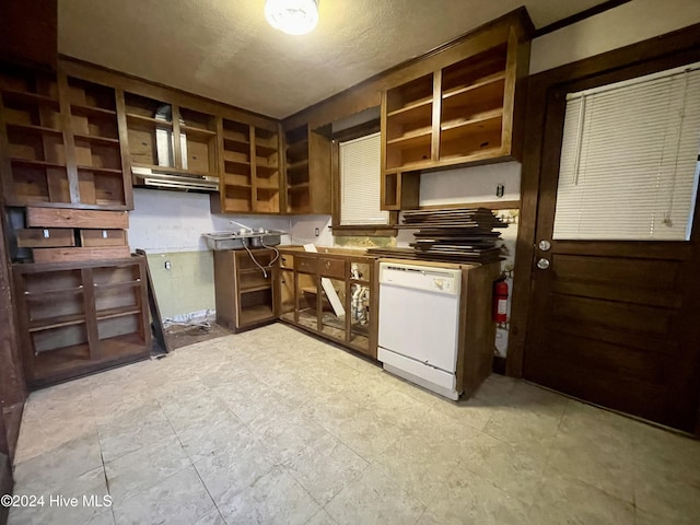 kitchen featuring a textured ceiling and white dishwasher