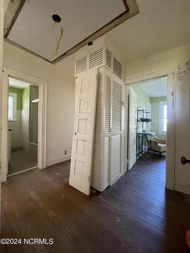 hall with dark hardwood / wood-style floors