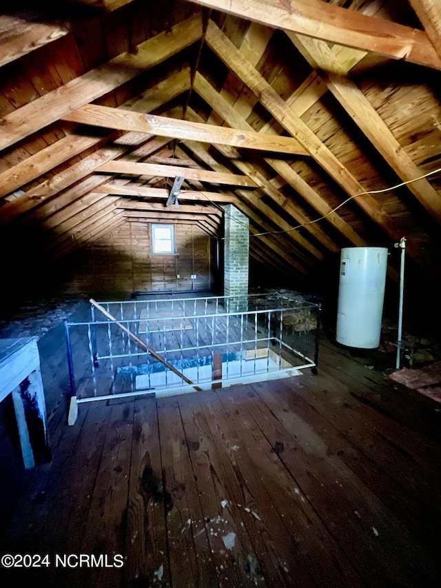 unfinished attic with water heater