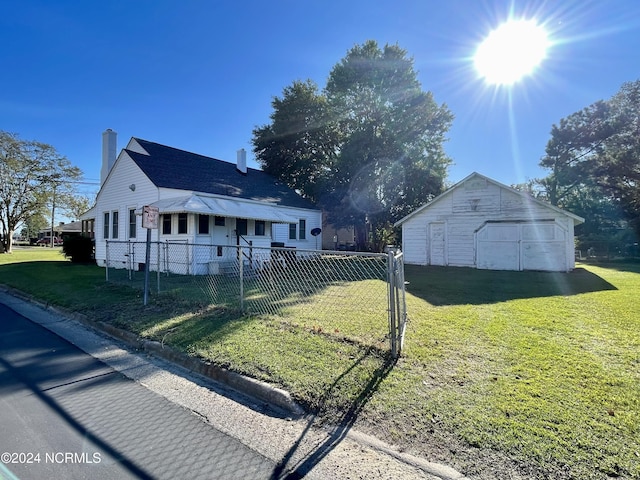 view of property exterior featuring an outbuilding and a yard