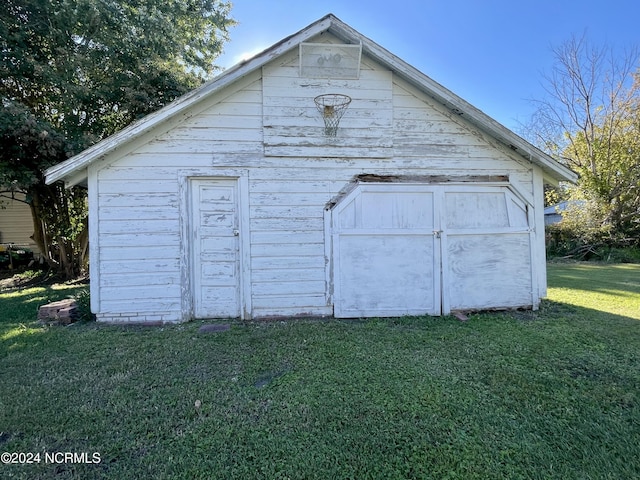 view of outbuilding with a lawn