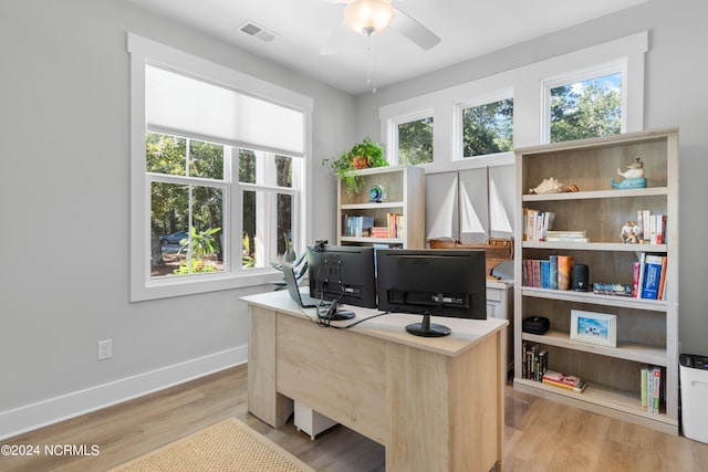 office space featuring light wood-type flooring and ceiling fan