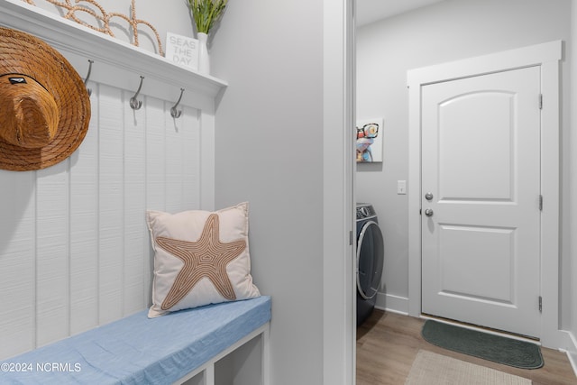 mudroom featuring light wood-type flooring and washer / clothes dryer