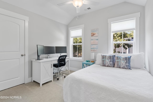 carpeted bedroom featuring ceiling fan, multiple windows, and lofted ceiling