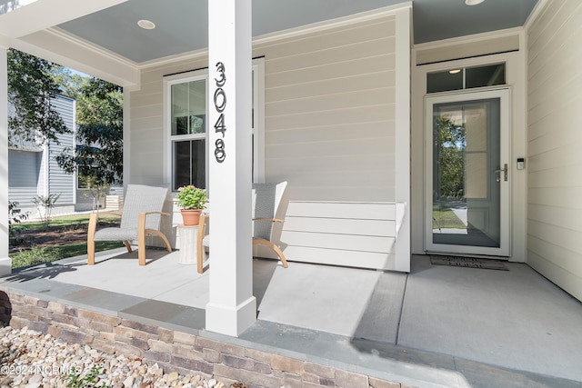 entrance to property featuring covered porch