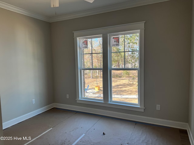 unfurnished room featuring ornamental molding, ceiling fan, and baseboards