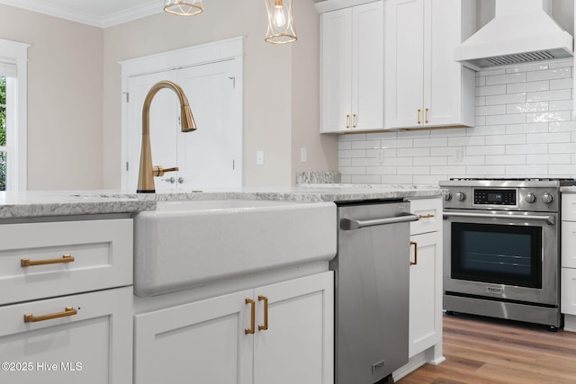 kitchen with tasteful backsplash, ornamental molding, custom range hood, and appliances with stainless steel finishes