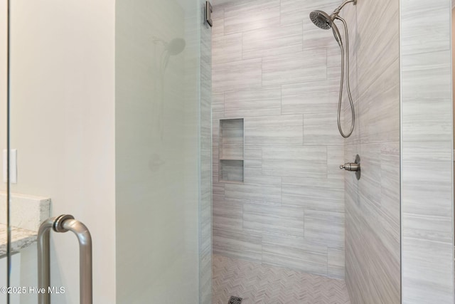 full bath featuring a shower stall