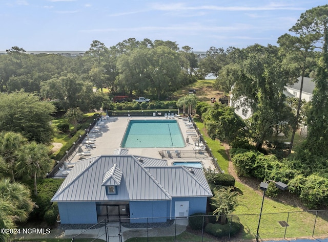 view of pool featuring fence