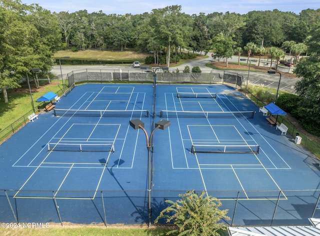 view of tennis court with fence