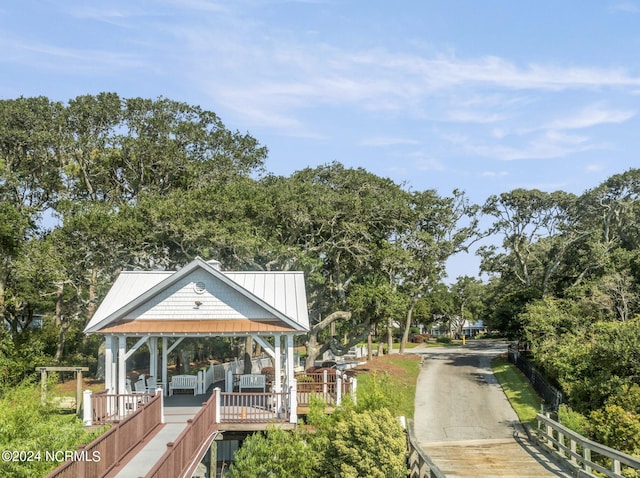 surrounding community featuring a gazebo and fence