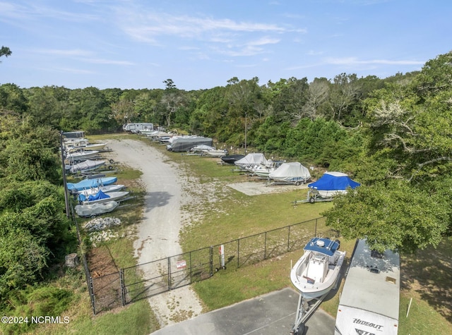 drone / aerial view featuring a wooded view