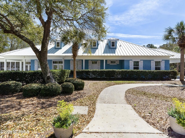 view of front of house featuring a standing seam roof and metal roof