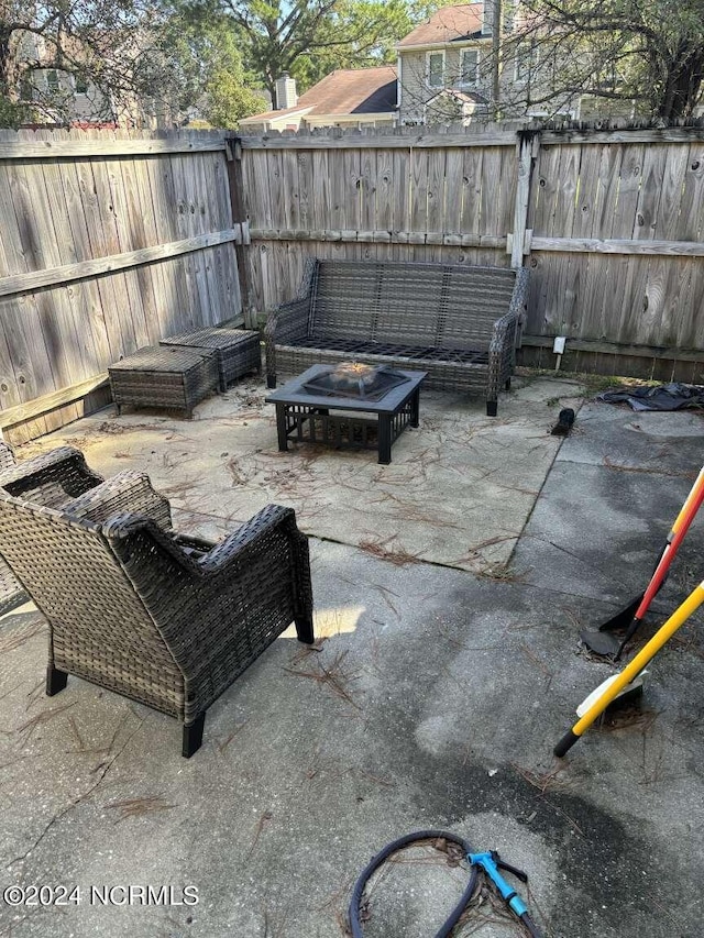 view of patio / terrace with an outdoor fire pit