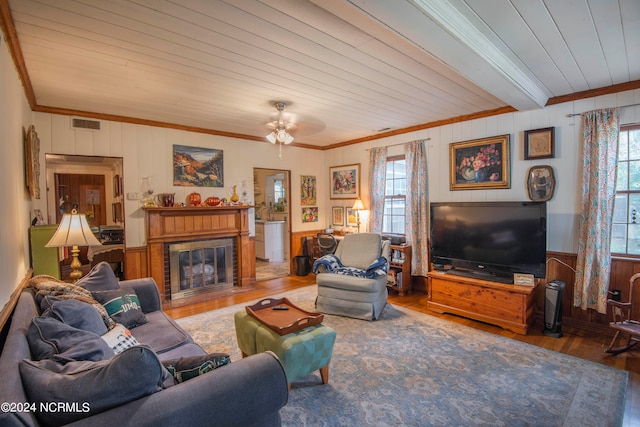 living room with wooden ceiling, hardwood / wood-style floors, crown molding, a fireplace, and ceiling fan