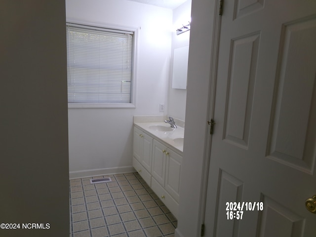 bathroom featuring vanity and tile patterned flooring