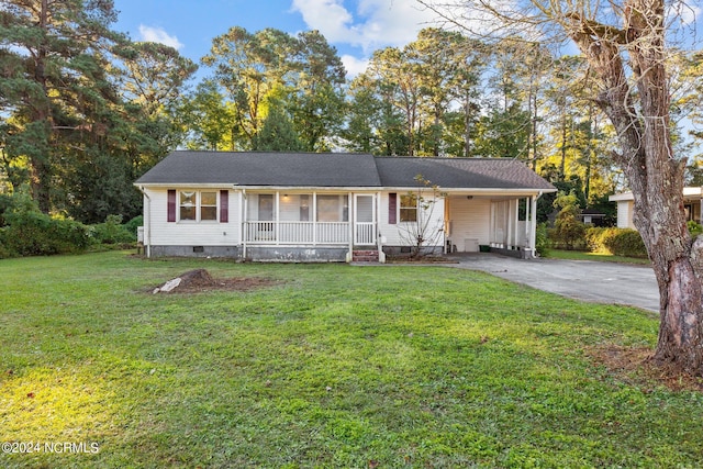 ranch-style home with a front yard and covered porch