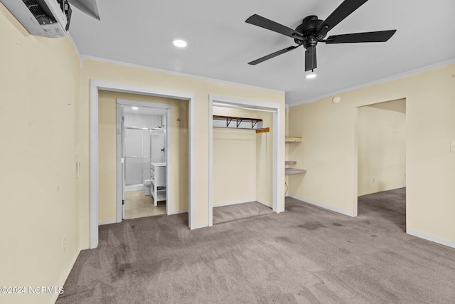 unfurnished bedroom featuring ensuite bathroom, carpet floors, ornamental molding, and ceiling fan