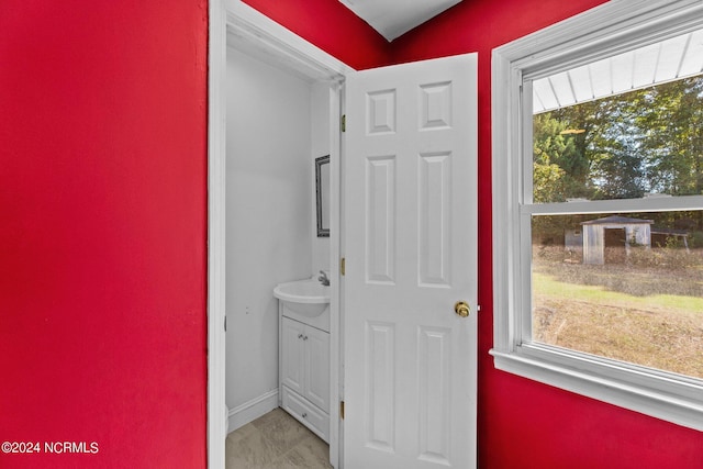 bathroom featuring vanity and a wealth of natural light