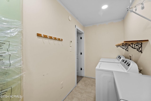 washroom featuring washer and clothes dryer