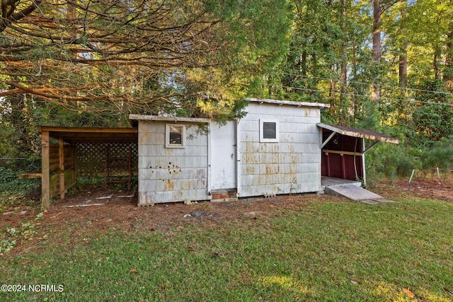 view of outdoor structure with a lawn