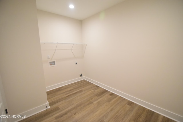 laundry room with hookup for an electric dryer, washer hookup, and hardwood / wood-style flooring