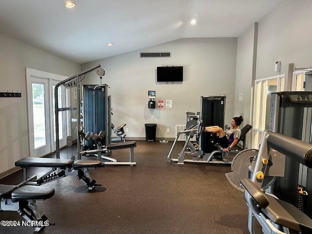 gym featuring vaulted ceiling