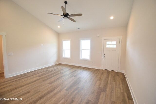 entrance foyer featuring lofted ceiling, hardwood / wood-style flooring, and ceiling fan