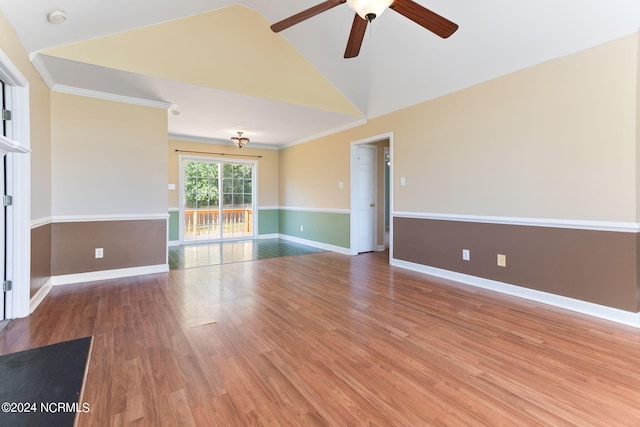 spare room with ceiling fan, high vaulted ceiling, crown molding, and hardwood / wood-style floors