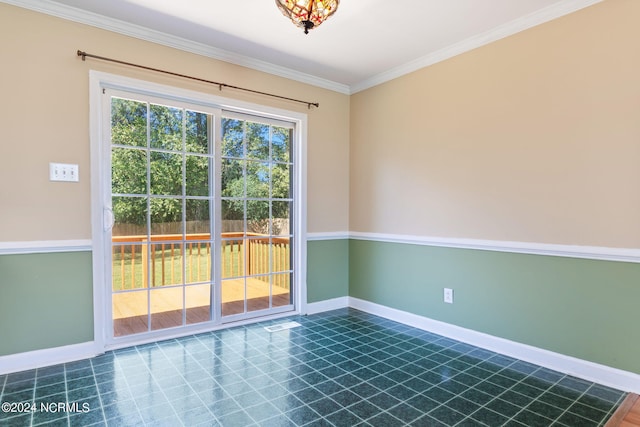 spare room featuring crown molding