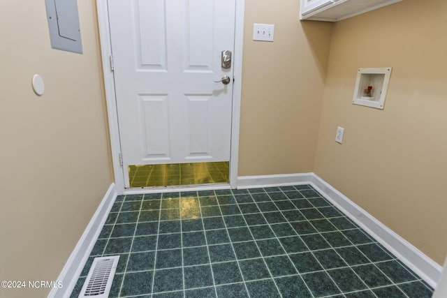 laundry room featuring hookup for a washing machine and electric panel