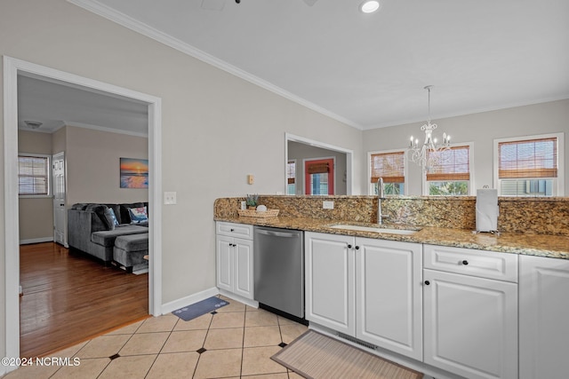 kitchen featuring sink, white cabinetry, light hardwood / wood-style floors, stainless steel dishwasher, and ornamental molding