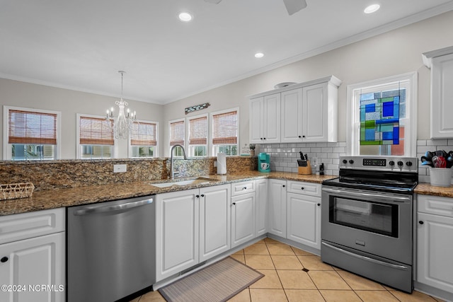 kitchen featuring appliances with stainless steel finishes, white cabinetry, sink, and ornamental molding