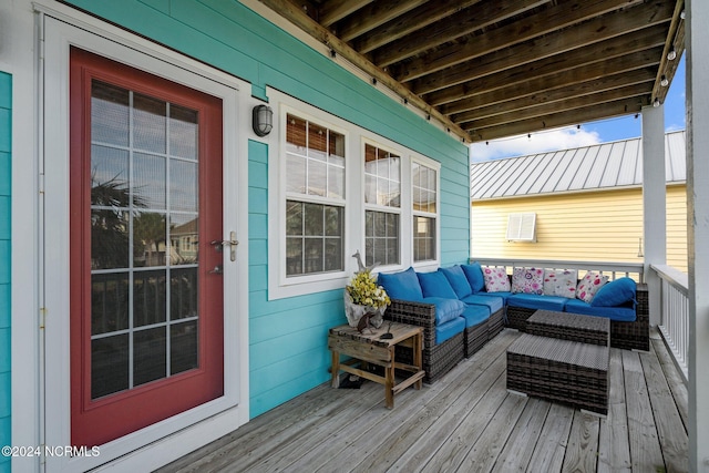 wooden terrace with outdoor lounge area