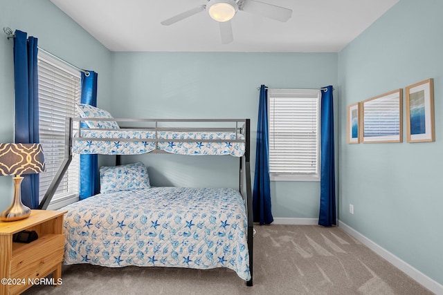 bedroom featuring ceiling fan and carpet floors