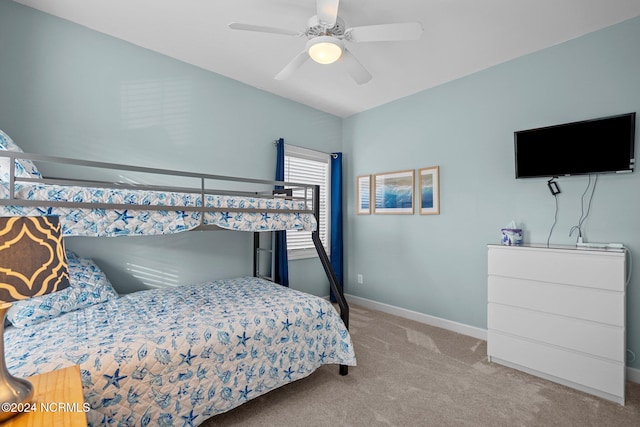 bedroom with ceiling fan and light carpet