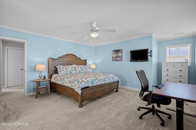 carpeted bedroom featuring crown molding and ceiling fan