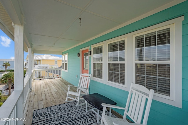 wooden terrace featuring a porch