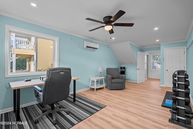 home office featuring a wall mounted air conditioner, ornamental molding, a wealth of natural light, and light wood-type flooring