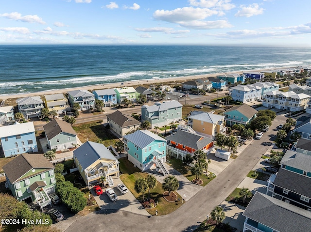 aerial view featuring a water view and a beach view