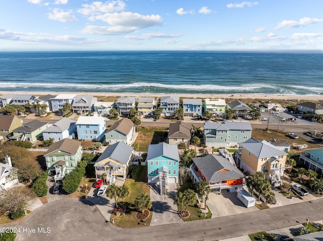 aerial view featuring a view of the beach and a water view