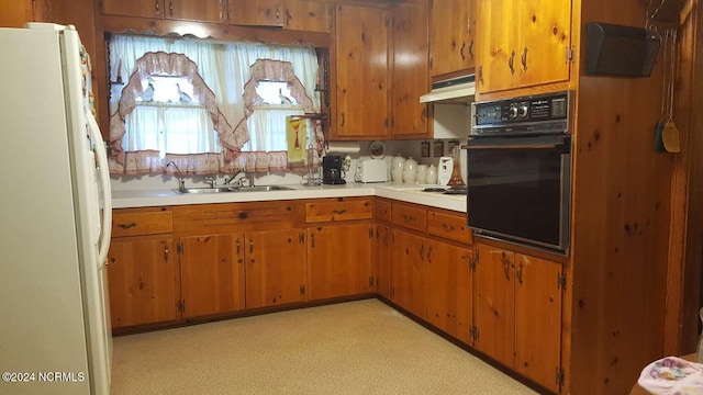 kitchen with sink and white appliances