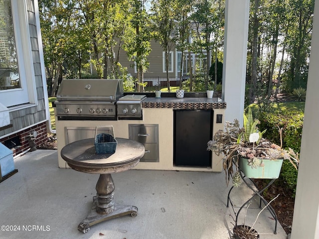 view of patio / terrace featuring exterior kitchen and area for grilling