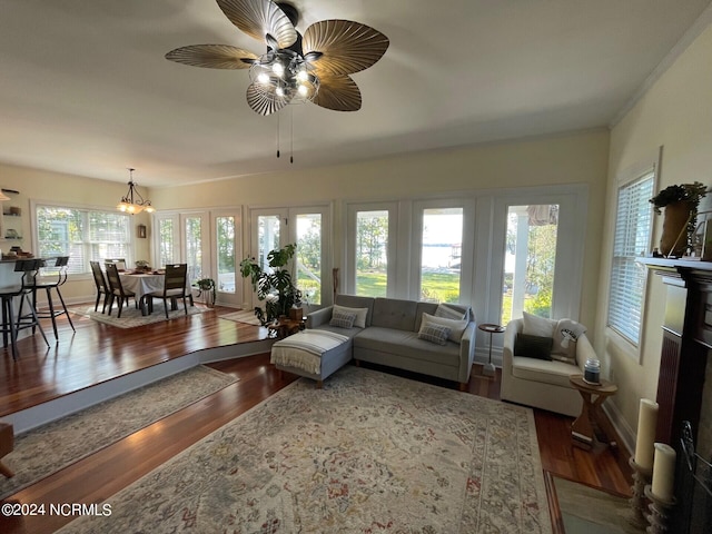 living room with wood-type flooring and ceiling fan