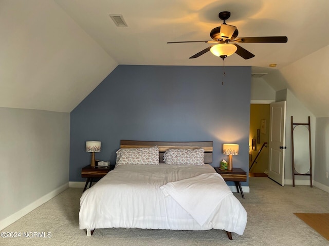 carpeted bedroom featuring ceiling fan and lofted ceiling